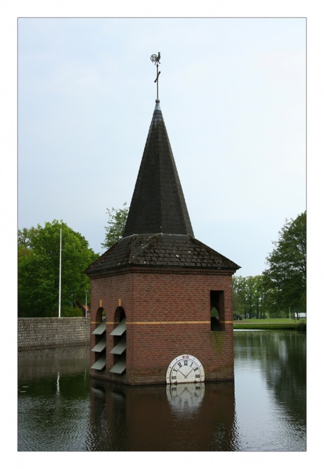 Church tower in pond