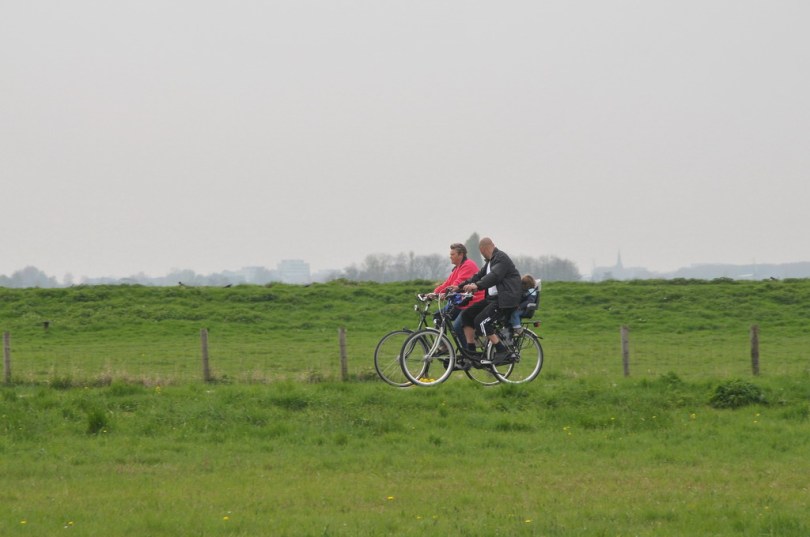Cyclists. By FaceMePLS from The Hague, The Netherlands - Buitenleven / Country Life. Wikmedia Commons. CC BY 2.0.